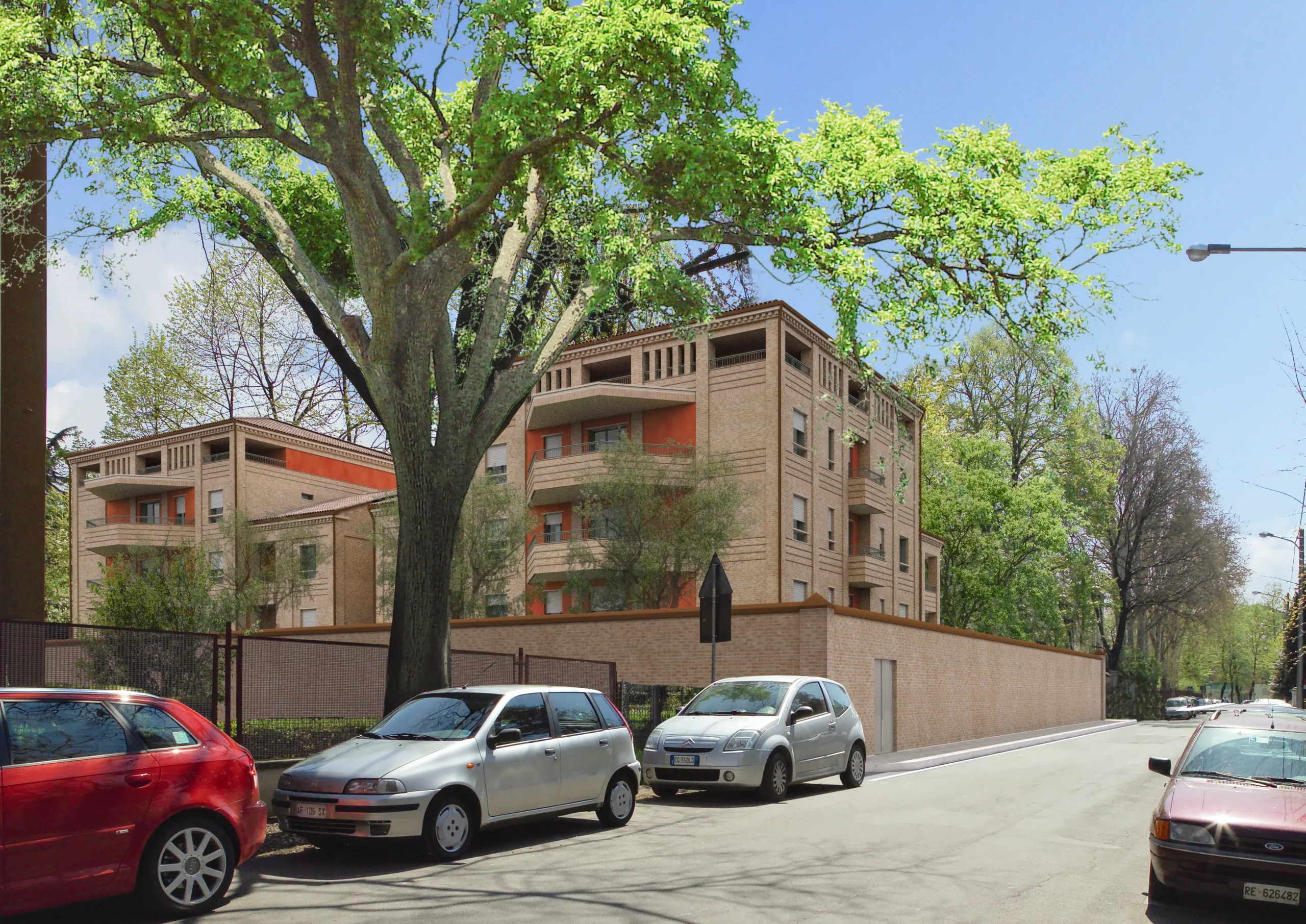 Complesso residenziale moderno con appartamenti e alberature lungo strada urbana realizzato da Impref